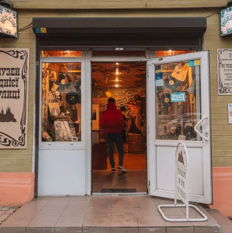 One Street Museum in Kyiv - main entrance with open doors and a visitor