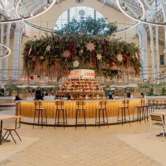 Circular bar with Christmas decorations in Bessarabskyi Market hall in Kyiv