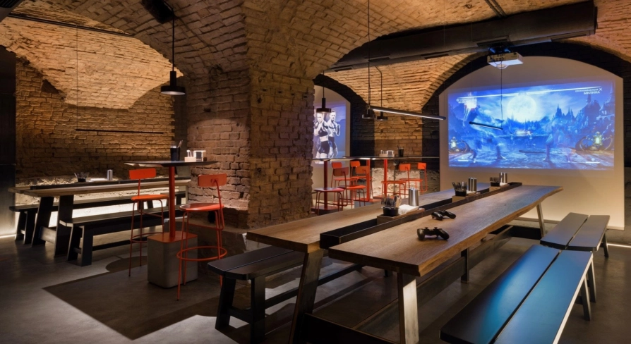 Punkraft - cozy interior space with brick walls wooden tables and warm lighting