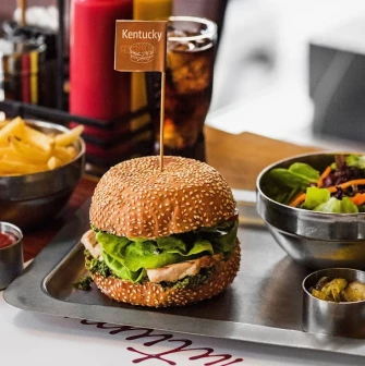 The Burger - Kentucky burger with fries and salad on metal tray
