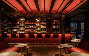 11 Mirrors - stylish hotel bar area with a long counter