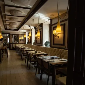 Elegant interior of the dining hall with soft lighting at the "Whisky Corner" bar in Kyiv