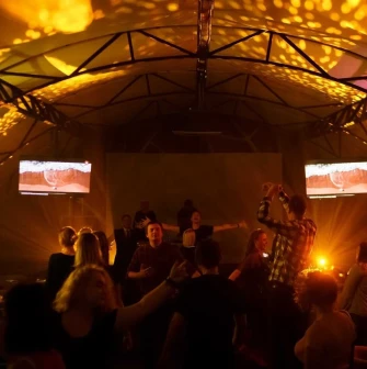 Party with bright lighting inside the Sungrilla Beach venue