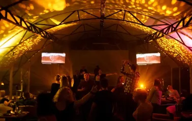 Party with bright lighting inside the Sungrilla Beach venue