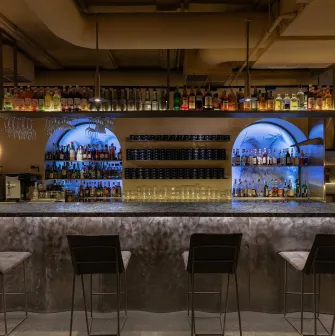 Bar area at Zmist in Kyiv with designer lighting and stylish furniture