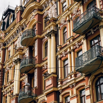 Syrotkin House - metal balconies and columns on the ornate historical facade