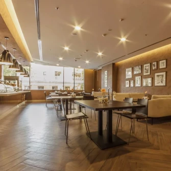 Senator Business Center in Kyiv - dining hall with brown walls and food serving line