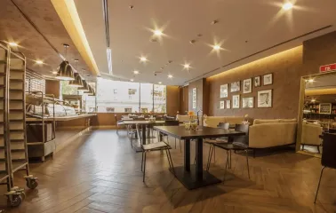Senator Business Center in Kyiv - dining hall with brown walls and food serving line