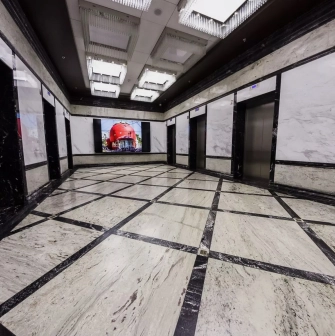 Senator Business Center in Kyiv - elevator hall with marble walls and geometric floor