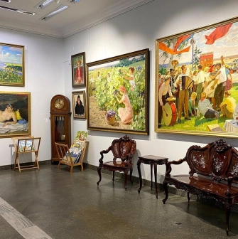 Soviet-era paintings and antique furniture at L'Art Gallery in Kyiv