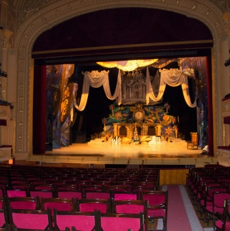 National Opera of Ukraine in Kyiv - grand stage view framed by red velvet curtains featuring a fairytale castle set design