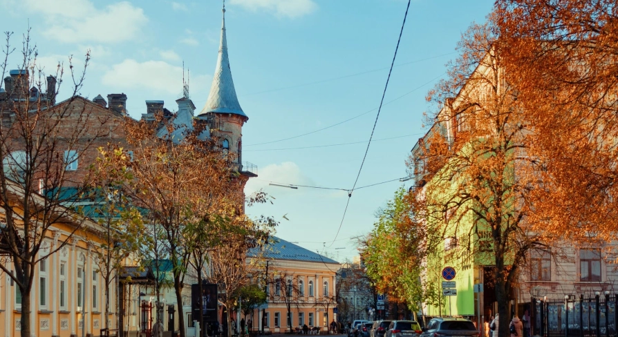 Yaroslaviv Val in Kyiv - cozy autumn street with red brick castle tower