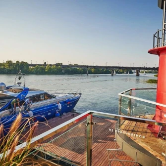 Mayak - close-up view of a boat docked at the restaurant's pier on the water