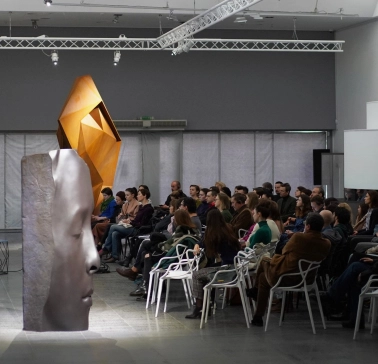 TSM m17 - large modern sculpture head placed near the building entrance