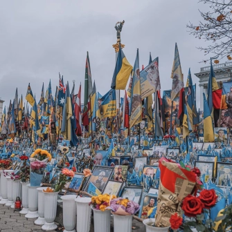 Independence Square in Kyiv - rows of portraits of fallen soldiers, flowers, and flags