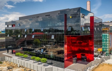 Glass building with a red insert in the UNIT.City innovation park in Kyiv