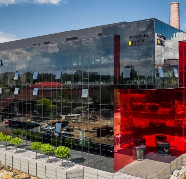 Glass building with a red insert in the UNIT.City innovation park in Kyiv