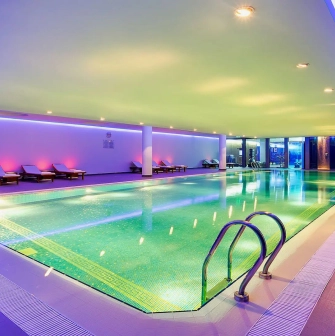 Hyatt Regency - indoor swimming pool with a bright, minimalist design