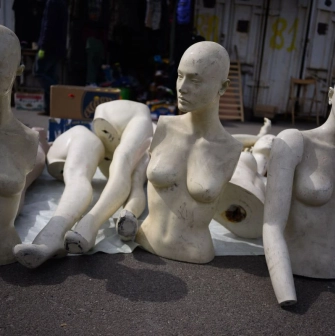 Mannequins on the floor of a flea market near Pochaina in Kyiv