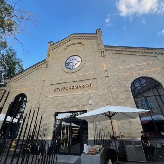 Kyiv Food Market - historic building facade with arched windows and entrance