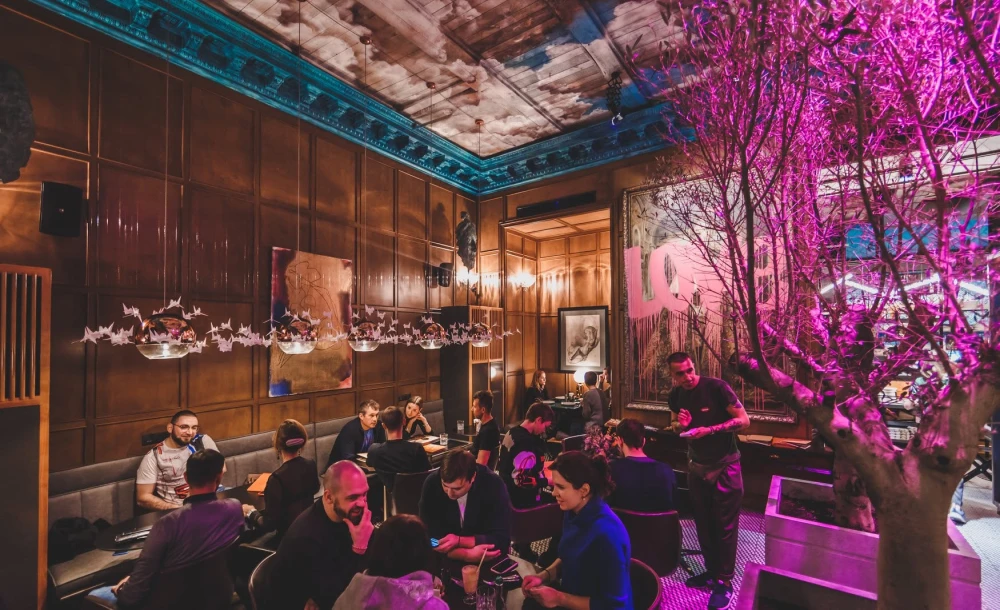 Stylish hall interior with pink lighting at Italiiska redaktsiia