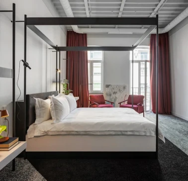 Minimalist room at the Bursa Hotel in Kyiv with wooden panels