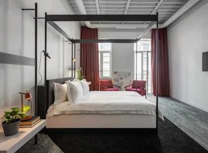 Minimalist room at the Bursa Hotel in Kyiv with wooden panels