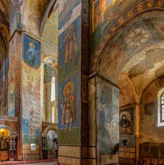 St. Cyril's Church in Kyiv - tall interior columns covered in ancient religious frescoes