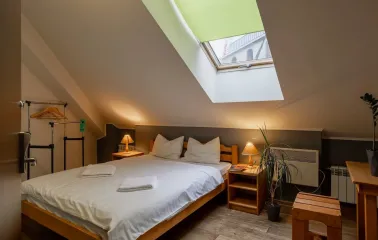 Room on the attic floor with a double bed at Dream Hostel in Kyiv
