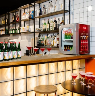 Bar counter with bottles, drinks, and cocktails at the Cinema Citi movie theater