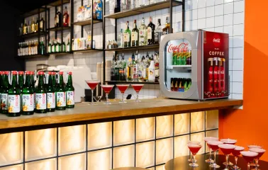 Bar counter with bottles, drinks, and cocktails at the Cinema Citi movie theater