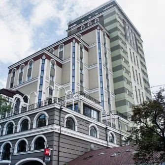Ibis Railway Station in Kyiv - tall hotel building facade with arched windows