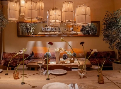 Seliam in Kyiv - cozy dining area with lights and flowers
