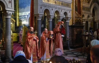 St. Volodymyr's Cathedral in Kyiv - priests in red robes lifting golden chalices at altar