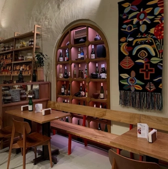 Poltava – cozy interior with arched wine shelf and traditional embroidered decor