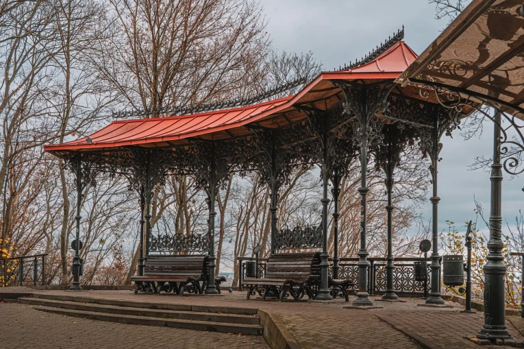 Volodymyrska Hill in Kyiv - ornate cast-iron gazebo with a red roof