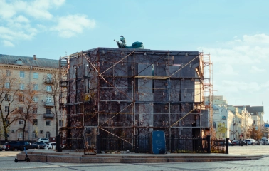 Monument to Bogdan Khmelnytsky in Kyiv - statue encased in massive protective scaffolding with only the mace visible