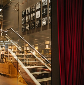 Chef's table - stairs behind red curtains leading to the second floor