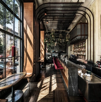 NAM - minimalist, dark bar counter with a focus on organized bottle display