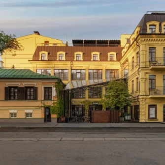 Bursa Hotel - minimalist hotel facade with dark tones and large, clean windows