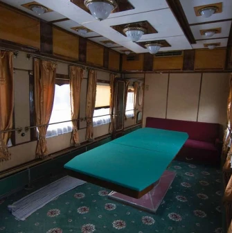 Railway Museum in Kyiv - interior of a vintage luxury train carriage featuring a large green billiard table