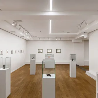 Showcases with miniature sculptures at Voloshyn Gallery in Kyiv