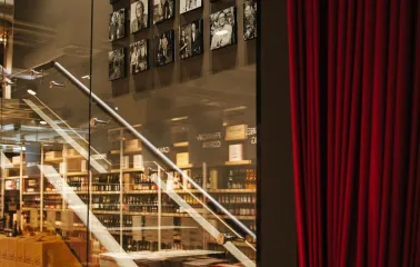 Chef's table - stairs behind red curtains leading to the second floor