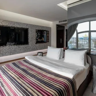 Designer room at the 11 Mirrors Design Hotel in Kyiv with modern decor and mirrored partitions