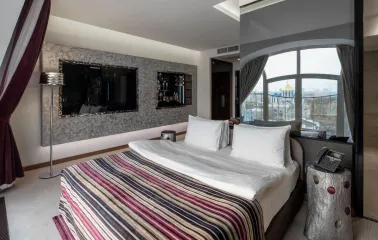 Designer room at the 11 Mirrors Design Hotel in Kyiv with modern decor and mirrored partitions