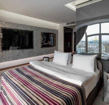 Designer room at the 11 Mirrors Design Hotel in Kyiv with modern decor and mirrored partitions