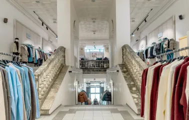 A grand stone staircase leading to the second floor of the Vsi Svoi store in Kyiv