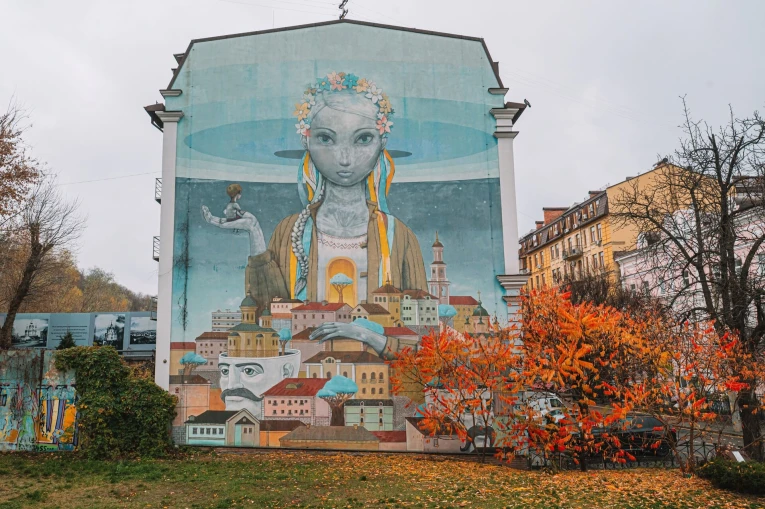 Renaissance mural - a girl with a wreath above Kyiv