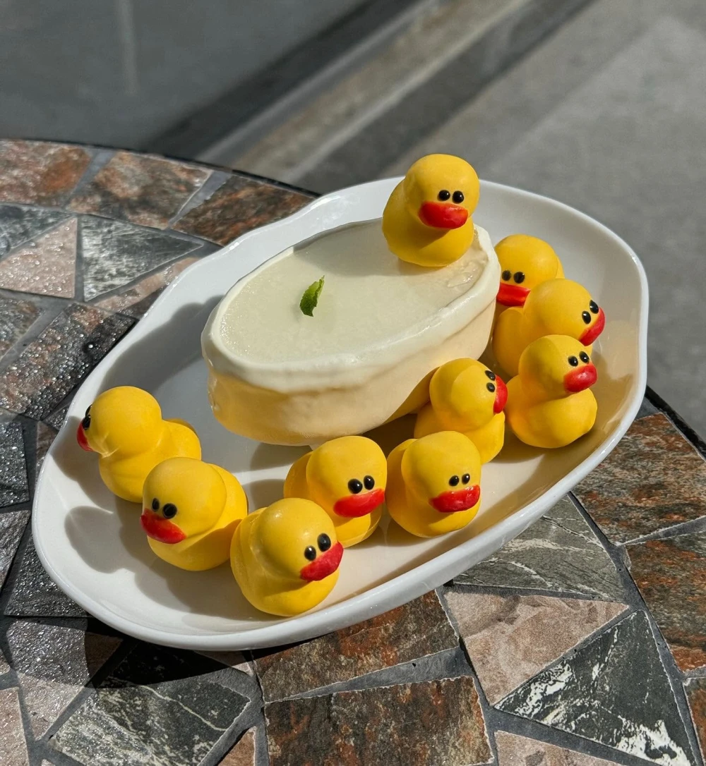 Original duck-shaped dessert served at Budynok Dyva in Kyiv