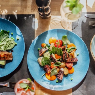 Restaurant Odesa - overhead view of two blue plates with seafood and salads